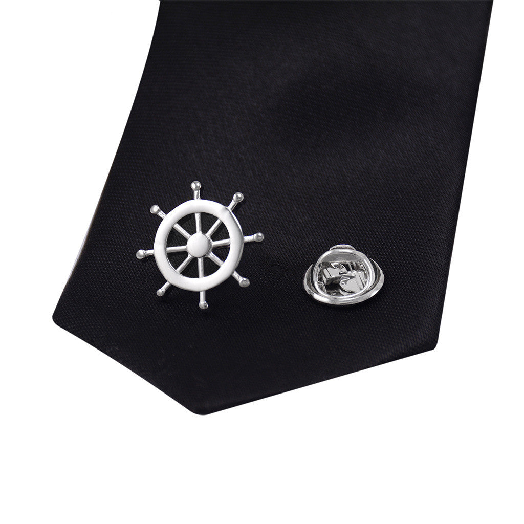 Silver rudder brooch