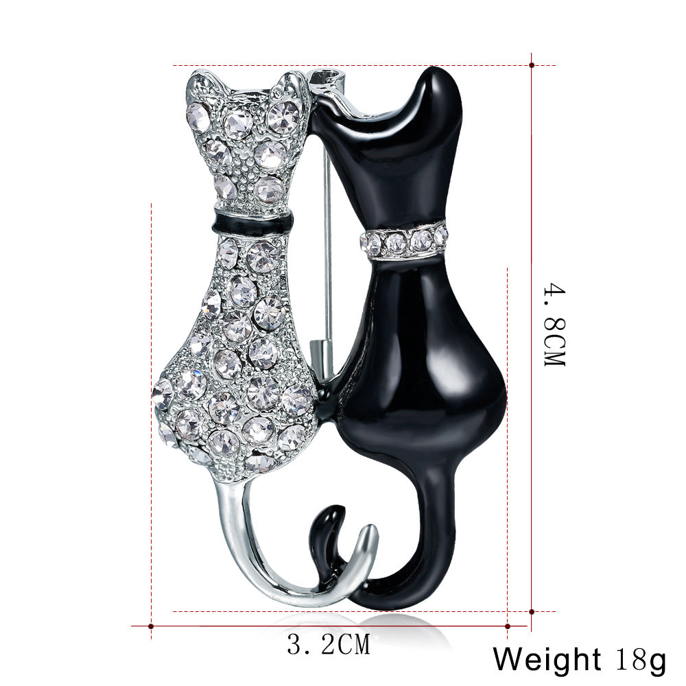 Fashion Black And White Paint Diamond Double Fox Brooch