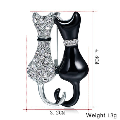 Fashion Black And White Paint Diamond Double Fox Brooch
