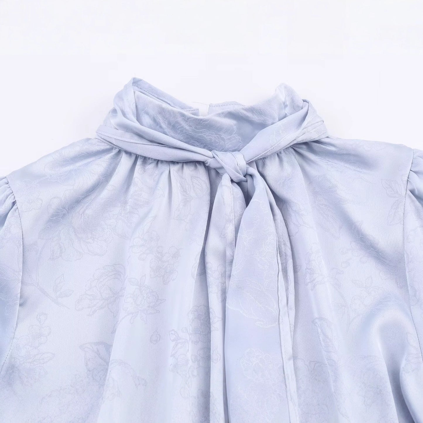Sleek Jacquard Silk-textured Blouse With A Bow Detail
