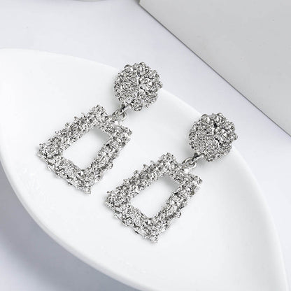 Metal earrings embossed floral earrings